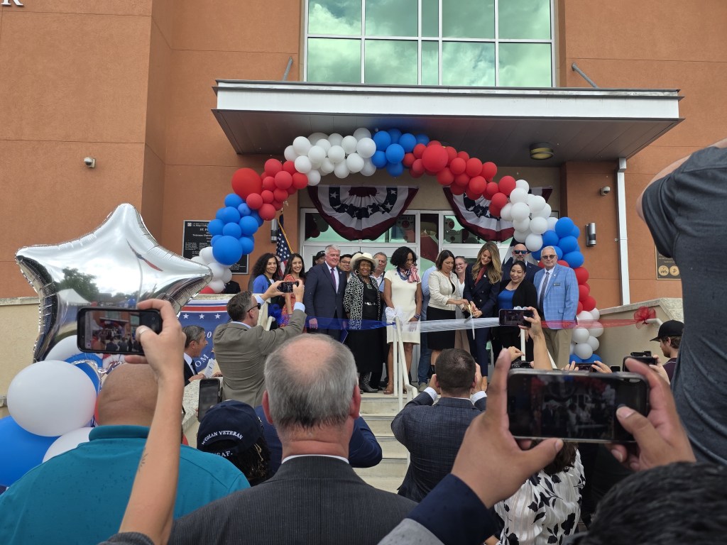 group photo with ribbon cutting